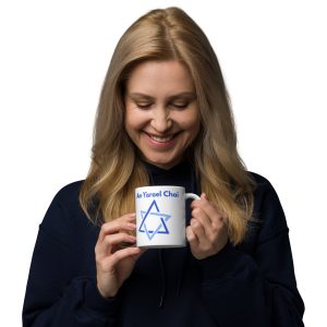 Woman holding a white mug with “Am Yisrael Chai” text and Star of David design.