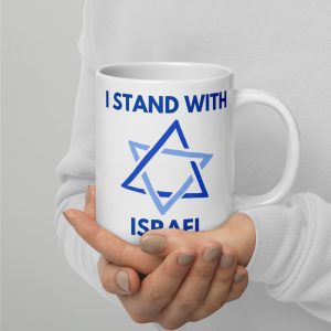 Person holding a white mug with “I Stand With Israel” text and Star of David design.