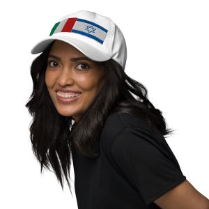 White cap with embroidered Italy and Israel flags, worn by a woman.