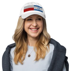 White cap with embroidered Poland and Israel flags, worn by a woman.